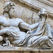 A statue representing an ancient Roman god.