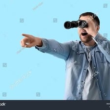 A person looking at a distant scene through binoculars.