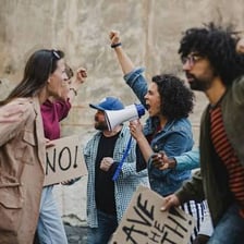 Two opposing groups demonstrating on opposite sides of a political divide.