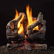 A piece of wood catching fire with visible flames.