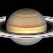 The ringed planet Saturn against a dark background