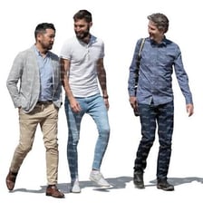 Three casually dressed men walking together.