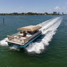 A recreational boat carrying passengers on the water.