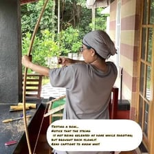 A person with a bow but no arrow or other weapon.