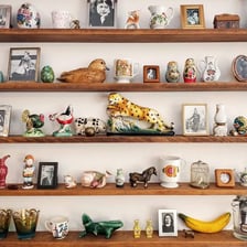 A small decorative ornament displayed on a shelf