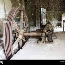 An idle piece of machinery standing unused and covered in dust.