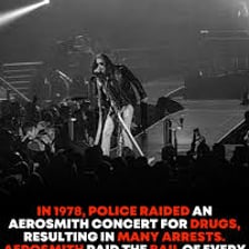 Police officers arresting a musician at a live performance.