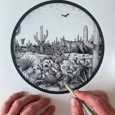 An artist applying paint in small dots