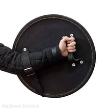 A solid protective shield of the kind used as defensive equipment.