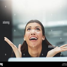 A person gesturing urgently in a frantic state.