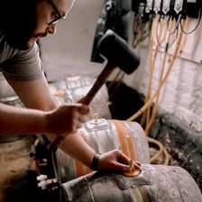 A beer barrel in a pub cellar, representing cask-conditioned beer.