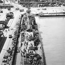 Naval ships moored in a dockyard