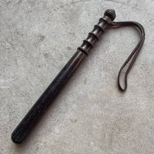 A short police truncheon or baton