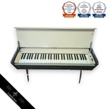 A vintage electric organ with a keyboard and drawbars