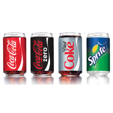 Several fizzy soft drinks served in glasses.