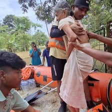 Rescue worker helping a person to safety