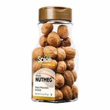 Whole nutmeg seeds beside grated nutmeg