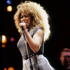 A popular singer performing to an enthusiastic audience.