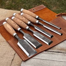 A metal woodworking chisel with a wooden handle