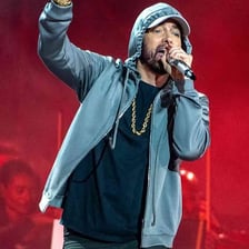 Eminem performing as a rapper on stage.