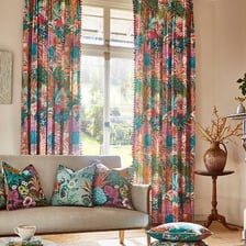 Fabric drapes spread or scattered across a room