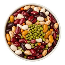 A bowl containing dried beans, which are legume pulses.