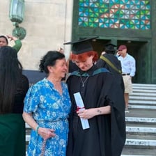 Graduates at a university ceremony with caps and gowns