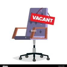 An empty workplace with a vacancy sign
