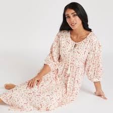 A nightie displayed beside a necktie