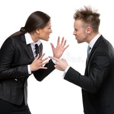 Two people engaged in a heated verbal argument.