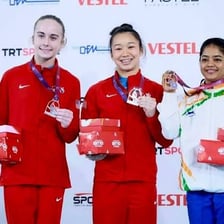 Top athletes standing on a winners’ podium