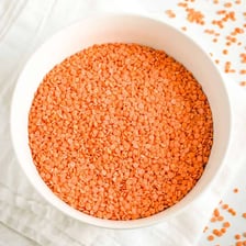 A bowl of small red lentils
