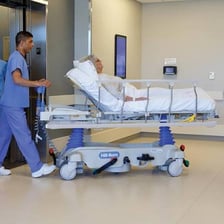 A wheeled hospital stretcher used to transport a patient