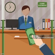 A customer depositing money at a bank counter