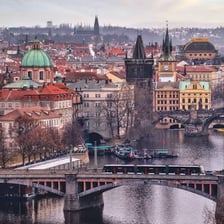 A view of Prague showing the Vltava River and historic city skyline