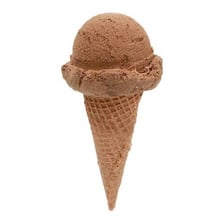 A scoop of ice cream served in a cone