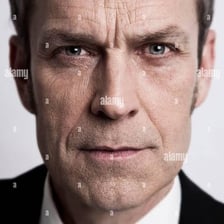A portrait showing a stern, unemotional facial expression