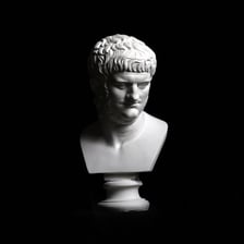 A classical bust depicting the Roman emperor Nero.