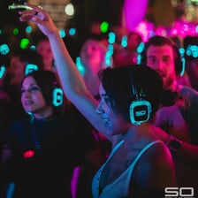 A disco party scene with people communicating over music