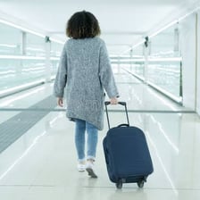 A traveller with luggage ready to set off.