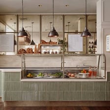 The interior of a delicatessen displaying prepared foods.