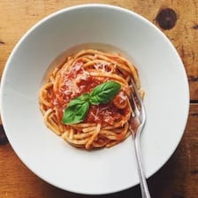 A plate of pasta served in an Italian restaurant