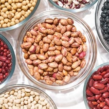 A bowl filled with dried beans.