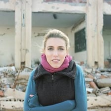A correspondent writing a report in an overseas setting