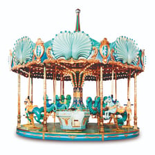 A carousel amusement ride with decorated horses