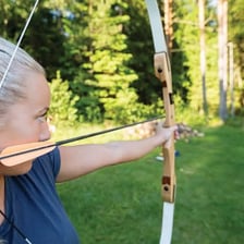 An archer drawing a bow and arrow