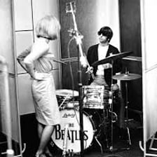 Ringo Starr performing as the Beatles drummer