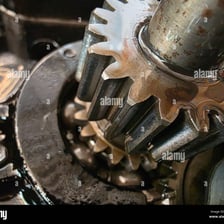A mechanical component coated with oil or grease.