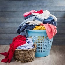A laundry basket filled with dirty clothes