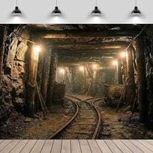 A vertical shaft leading down into an underground mine